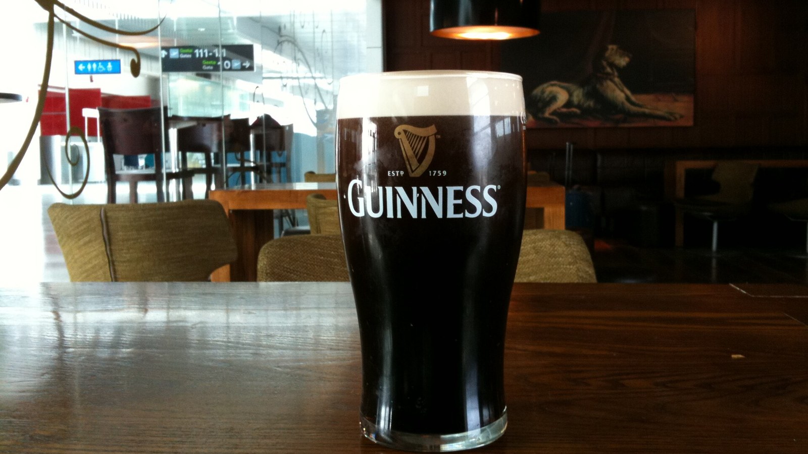 A pint of Guinness on a bar table