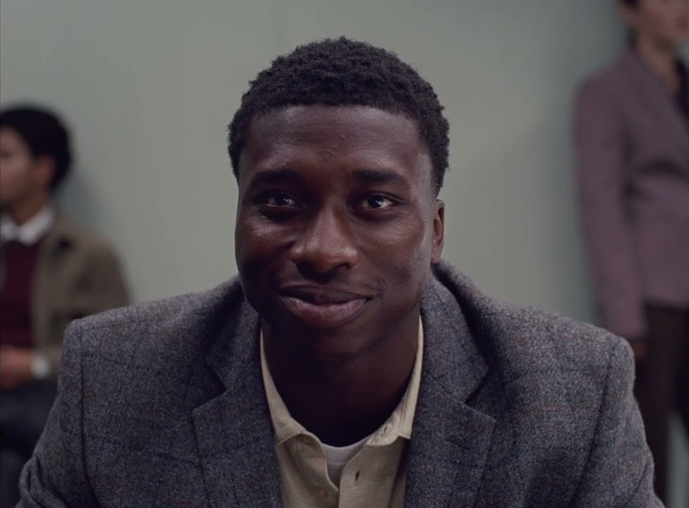 Ebenezer Gyau in the waiting room in People Like Us's film Dear [Name]