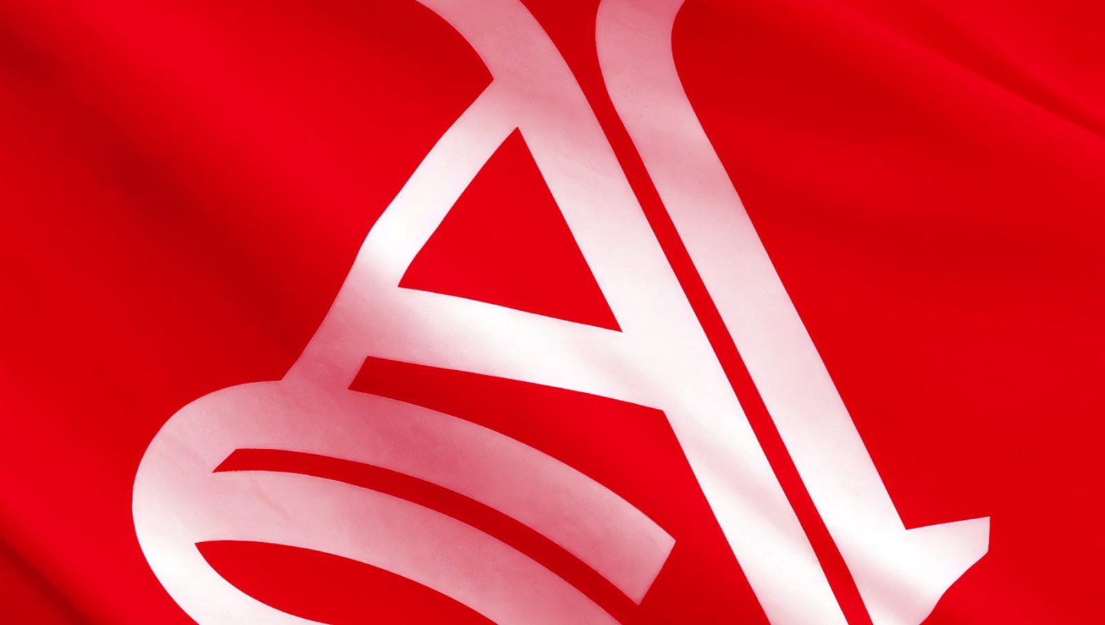 A large white gothic Arsenal A in the Rocastle style on a red flag