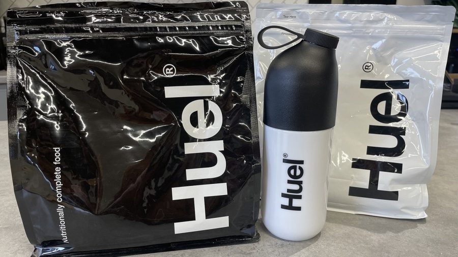 Bags of Huel powder and a Huel shaker bottle