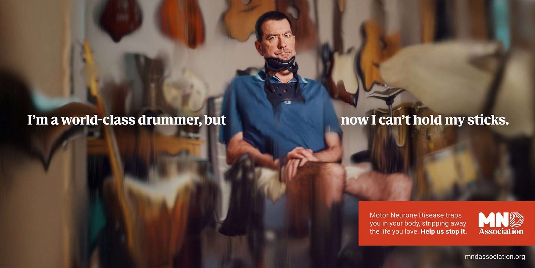 MND Association poster of Steve Williams among guitars, with the line I'm a world-class drummer, but now I can't hold my sticks